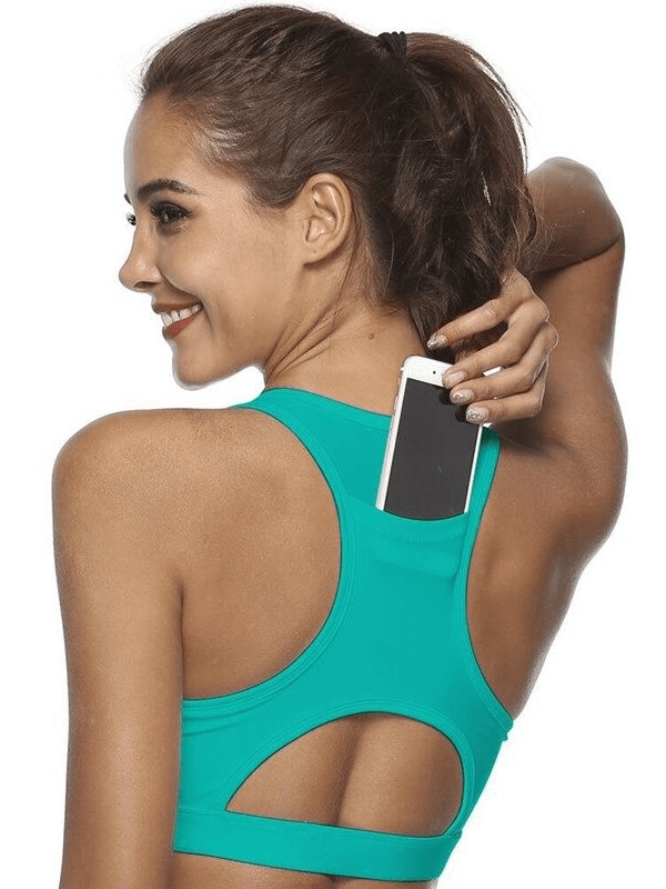 Woman wearing a stylish elastic sports bra with back pocket holding phone, perfect for fitness and workouts.